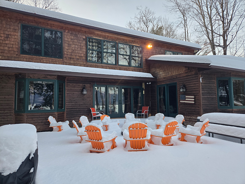 Outdoor gathering space of winter rental home in Bolton NY